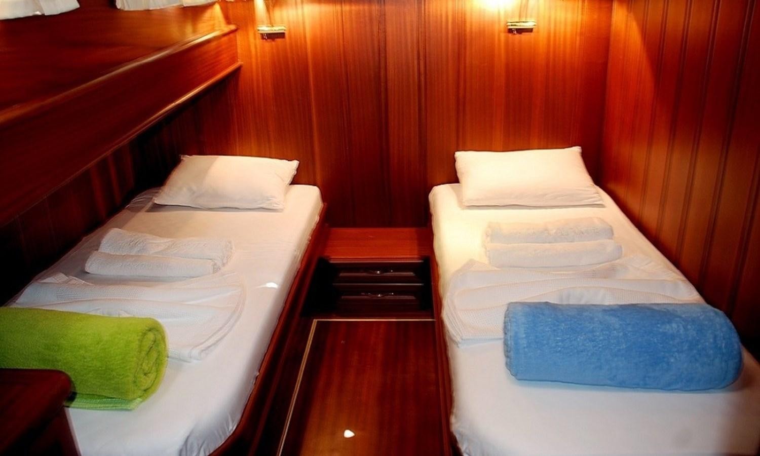 a couple of beds in a room aboard ATALANTE Yacht for Sale