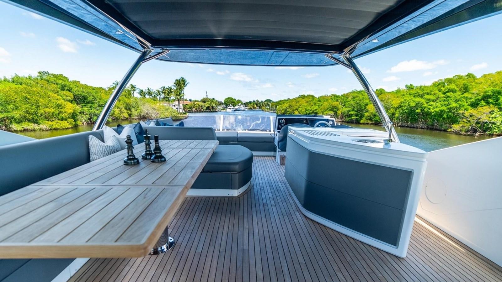 a deck with a computer and a television on it aboard 76 YACHT Yacht for Sale