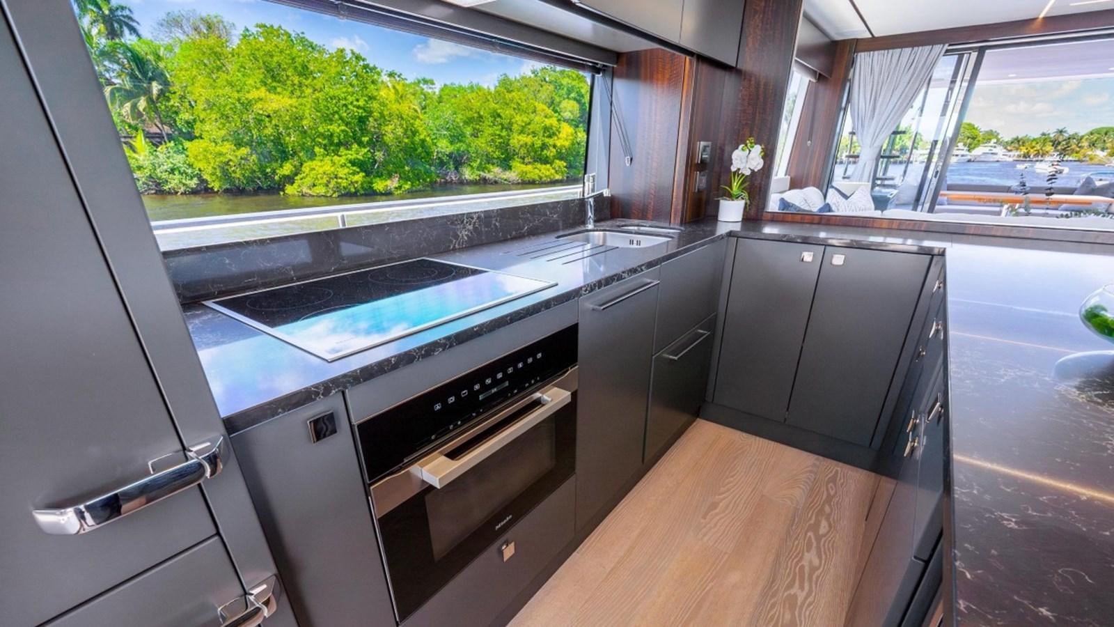 a kitchen with a large window aboard 76 YACHT Yacht for Sale