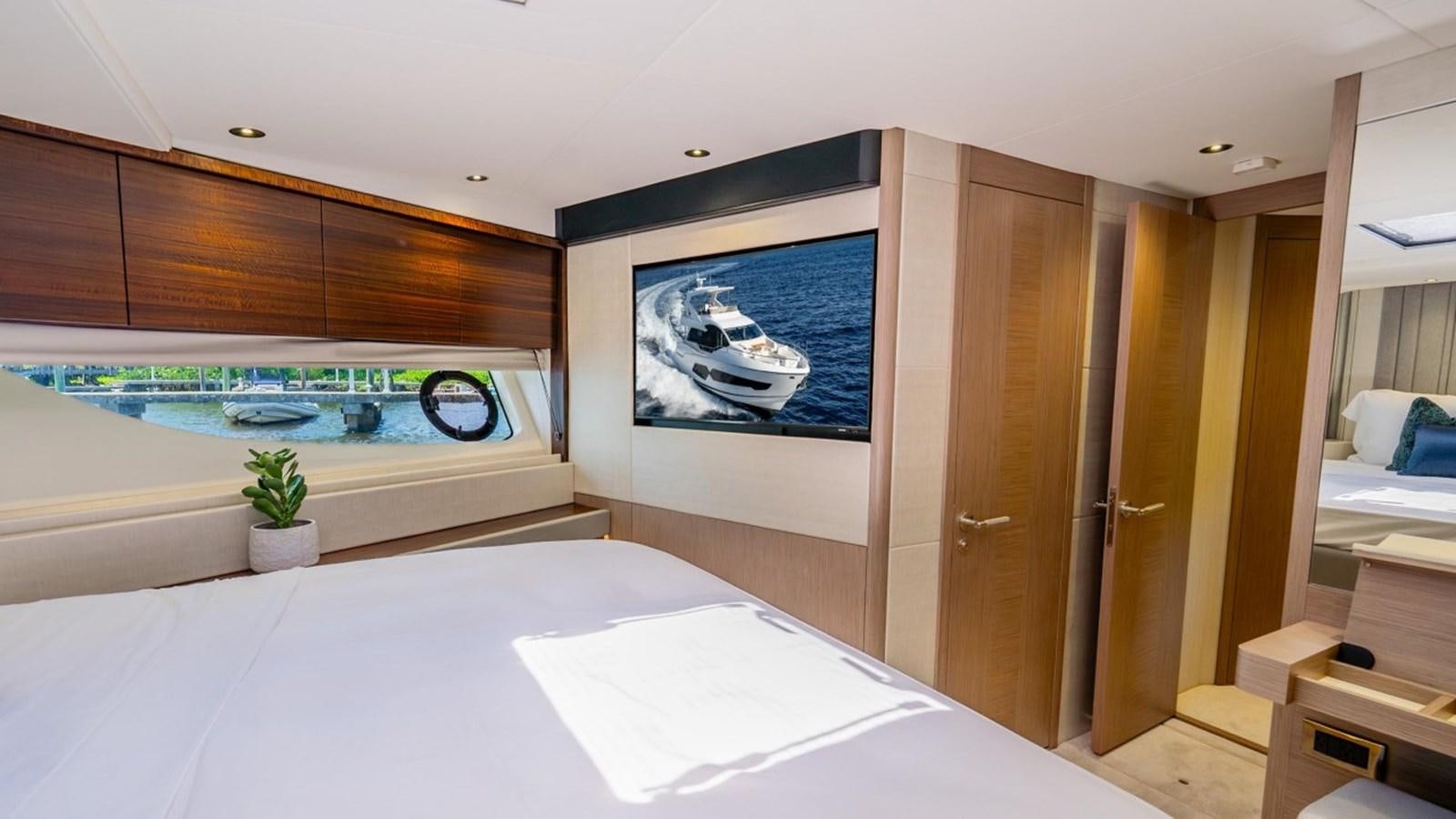 a room with a large bed and a fish tank aboard 76 YACHT Yacht for Sale