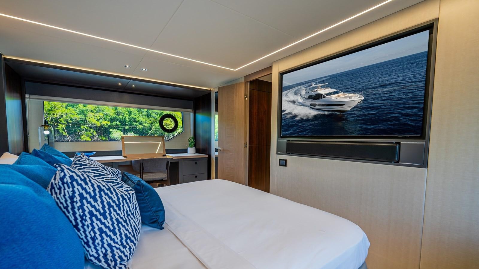 a room with a bed and a television aboard 76 YACHT Yacht for Sale
