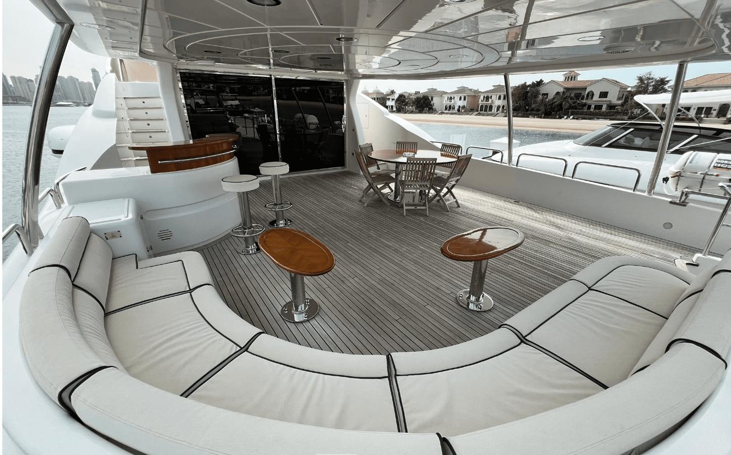 a room with a couch and chairs aboard 2008 BENETTI 100 Yacht for Sale