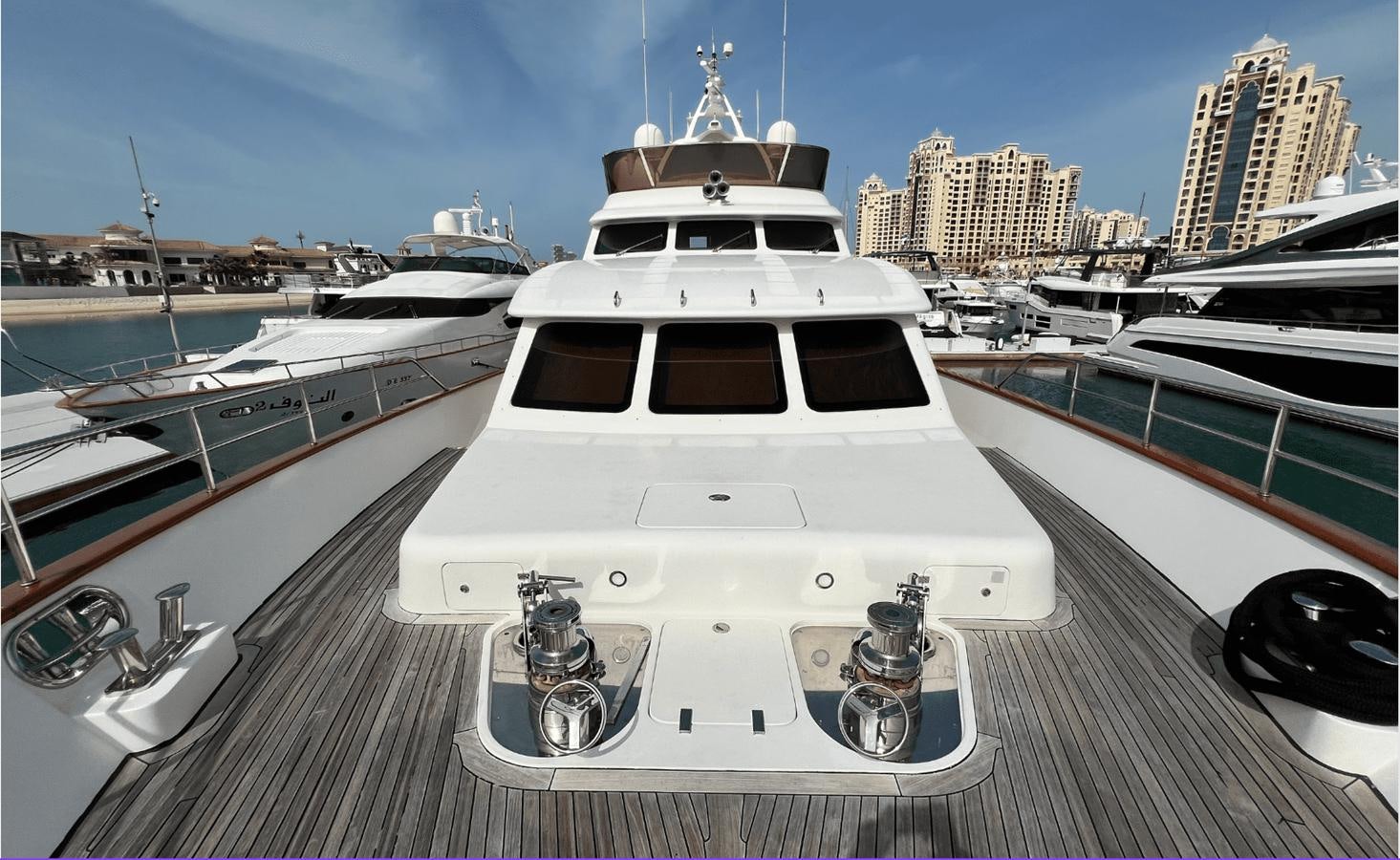 a white yacht in a harbor aboard 2008 BENETTI 100 Yacht for Sale