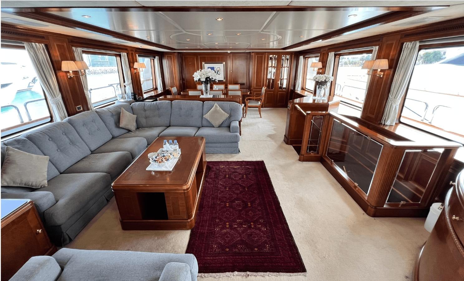 a living room with a couch and a coffee table aboard 2008 BENETTI 100 Yacht for Sale