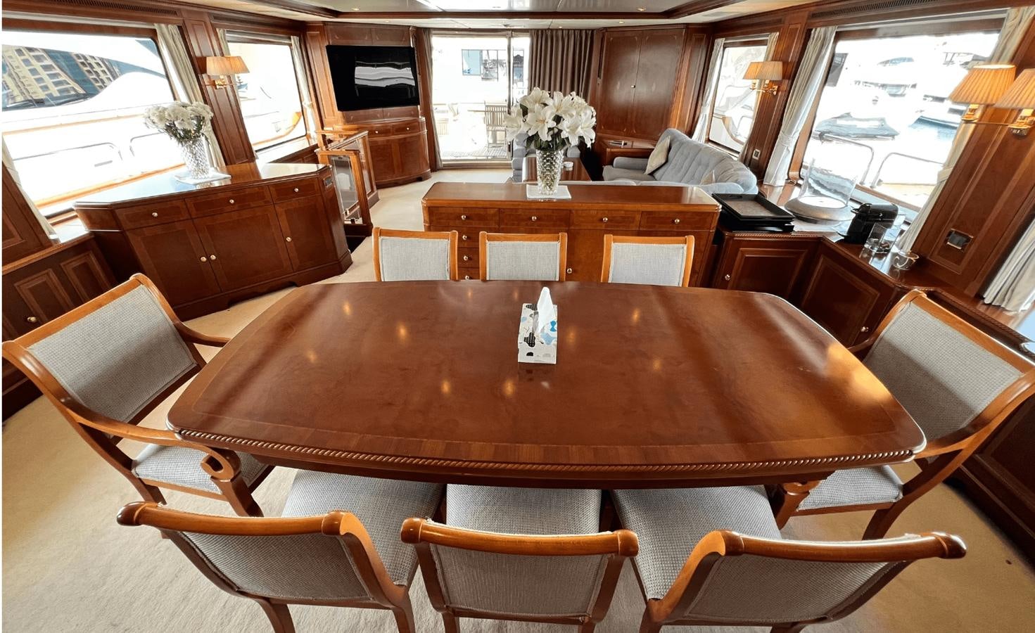 a large wooden table in a restaurant aboard 2008 BENETTI 100 Yacht for Sale