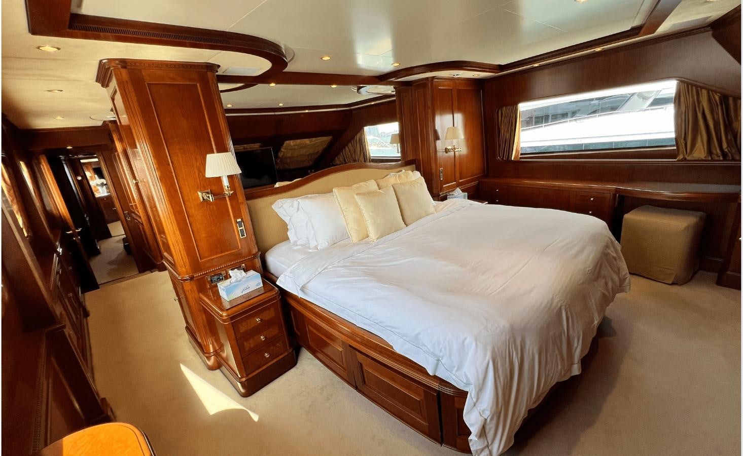 a room with a bed and a chair aboard 2008 BENETTI 100 Yacht for Sale