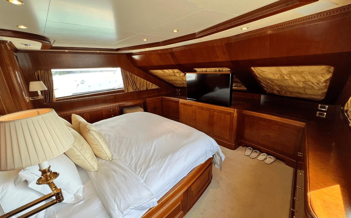 a room with a bed and a television aboard 2008 BENETTI 100 Yacht for Sale