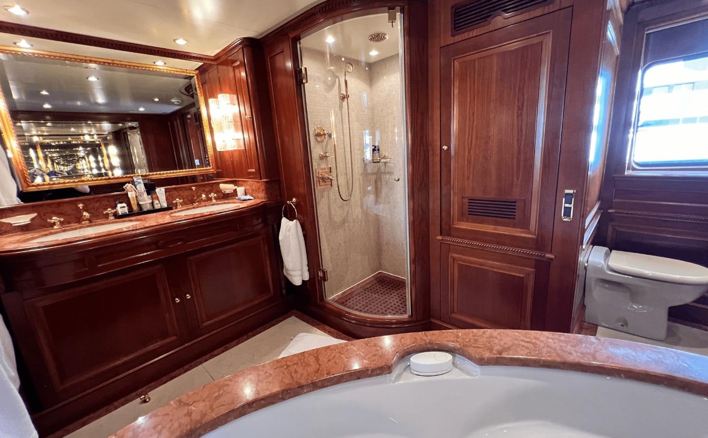 a bathroom with a bathtub and a toilet aboard 2008 BENETTI 100 Yacht for Sale