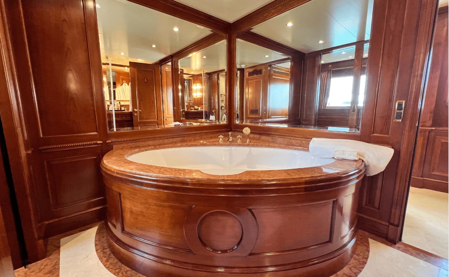 a large bathtub in a bathroom aboard 2008 BENETTI 100 Yacht for Sale