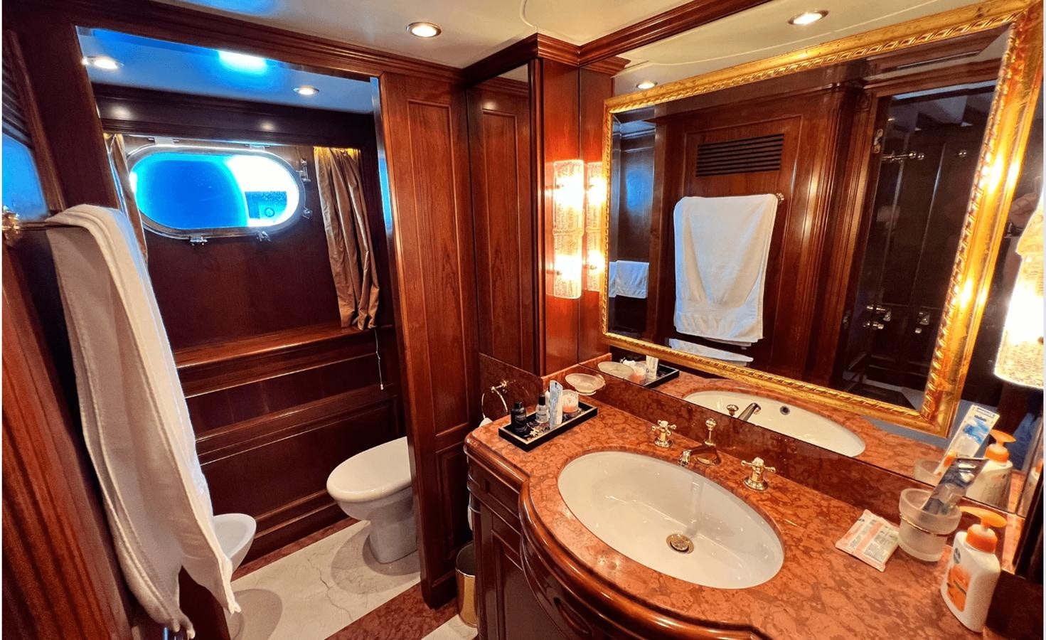 a bathroom with a large mirror aboard 2008 BENETTI 100 Yacht for Sale