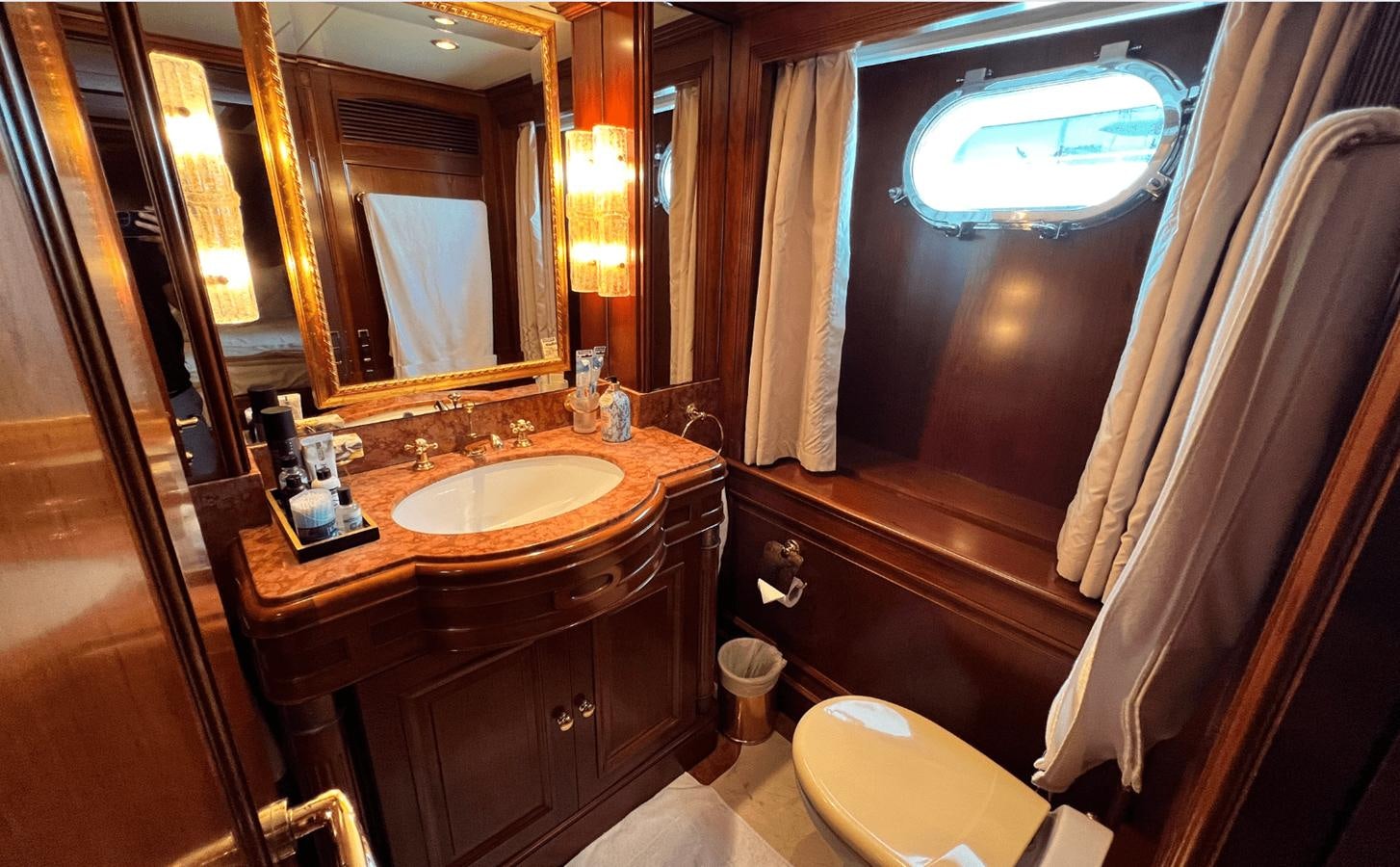 a bathroom with a sink and a toilet aboard 2008 BENETTI 100 Yacht for Sale