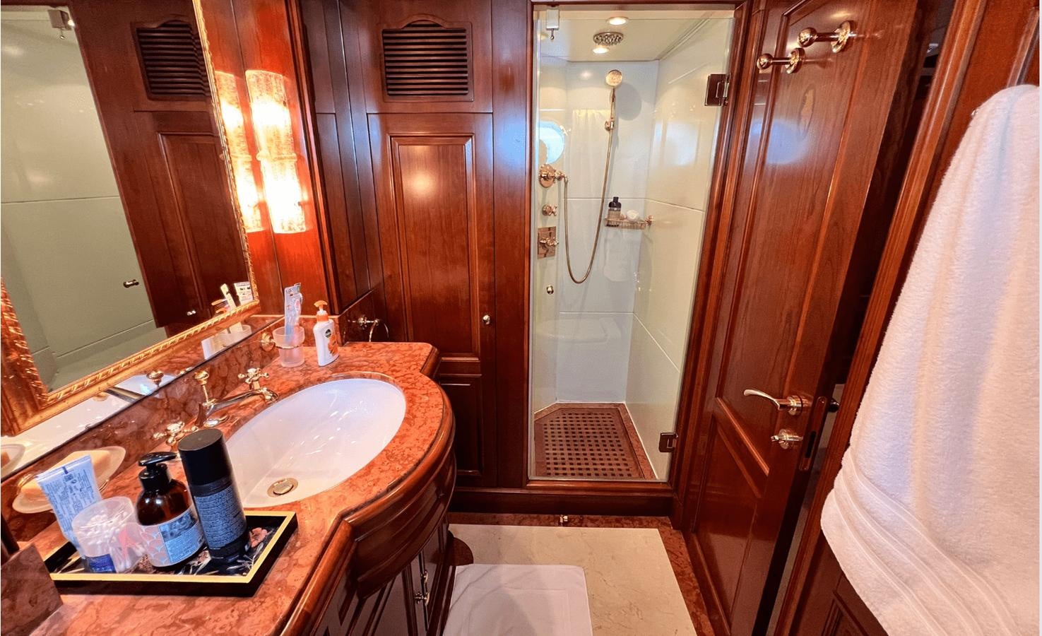 a bathroom with a sink and a mirror aboard 2008 BENETTI 100 Yacht for Sale