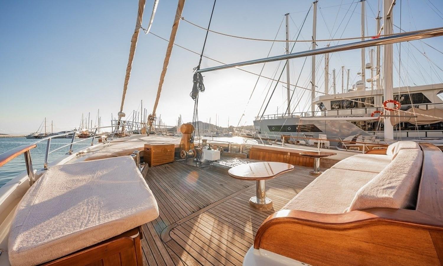 a deck with a deck and a boat on it aboard CUSTOM MADE 30 M MOTORSAILOR Yacht for Sale
