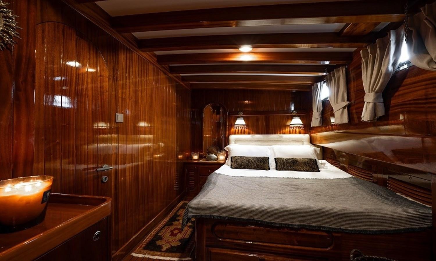 a room with a couple of beds aboard CUSTOM MADE 30 M MOTORSAILOR Yacht for Sale
