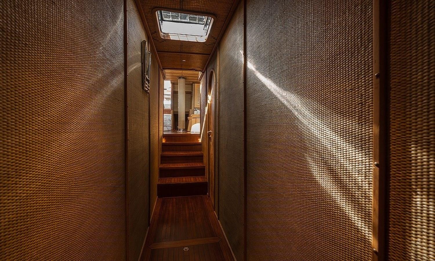 a hallway with wooden doors aboard CUSTOM MADE MOTORSAILOR Yacht for Sale