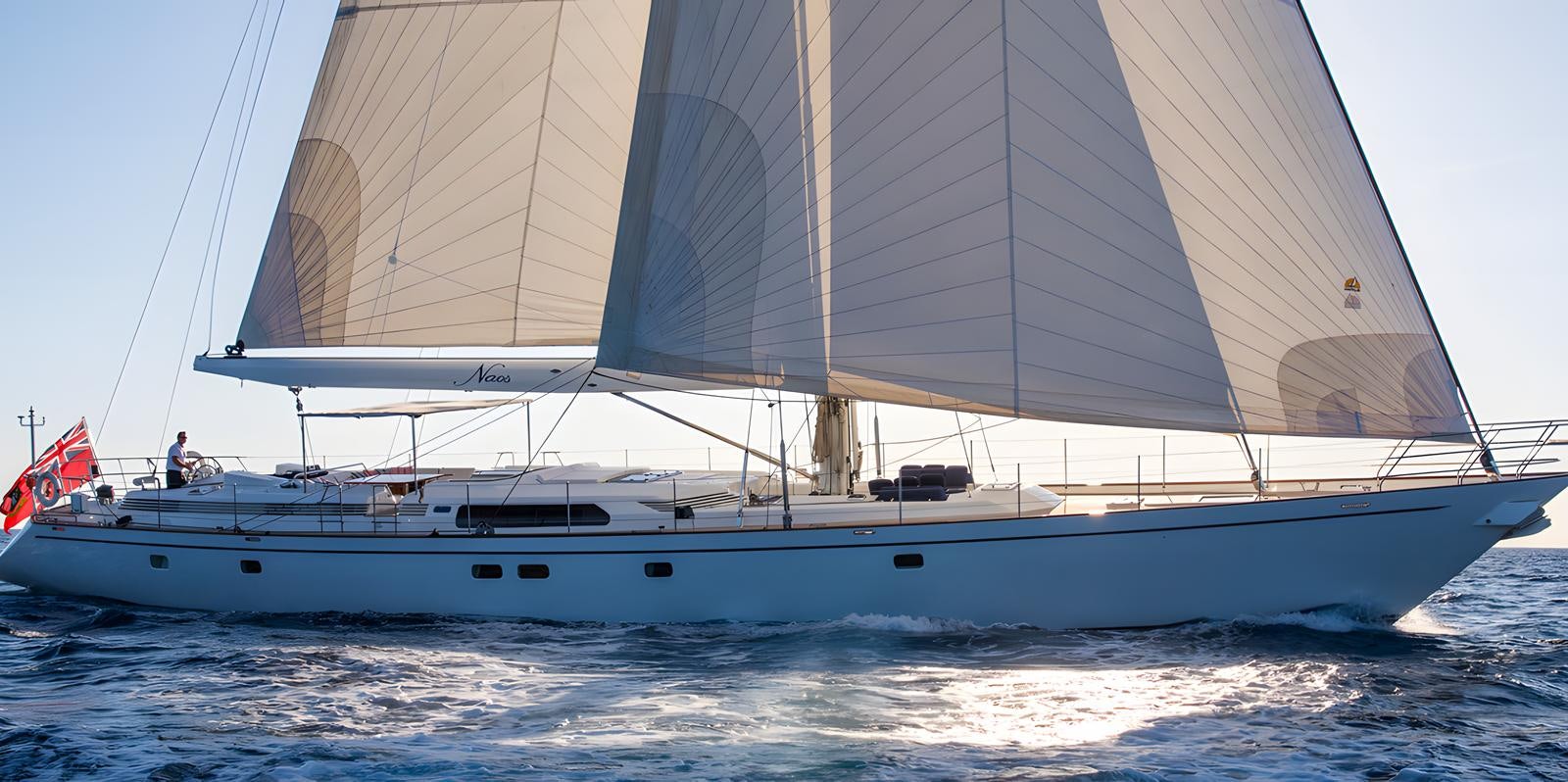 a white boat on the water aboard NAOS Yacht for Sale