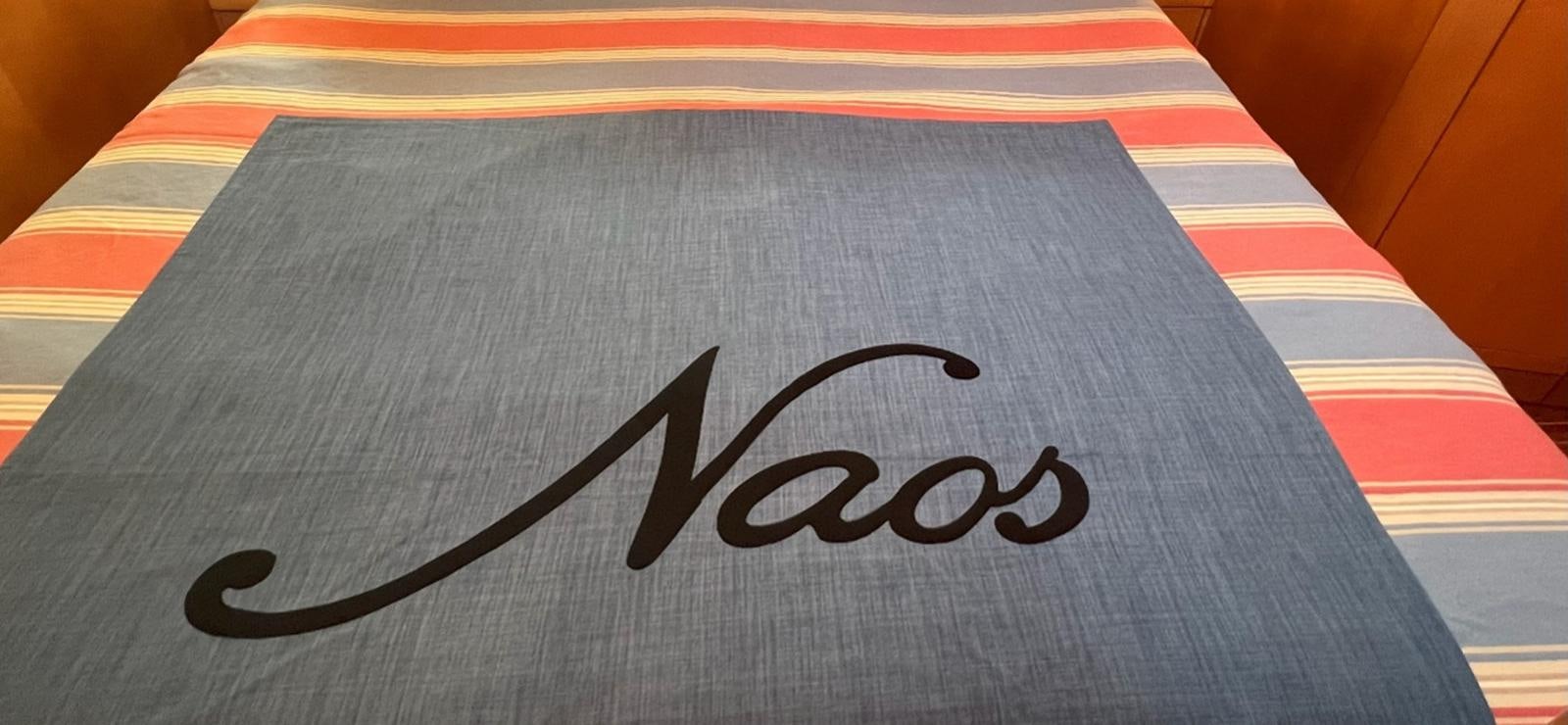 a black and white striped table aboard NAOS Yacht for Sale