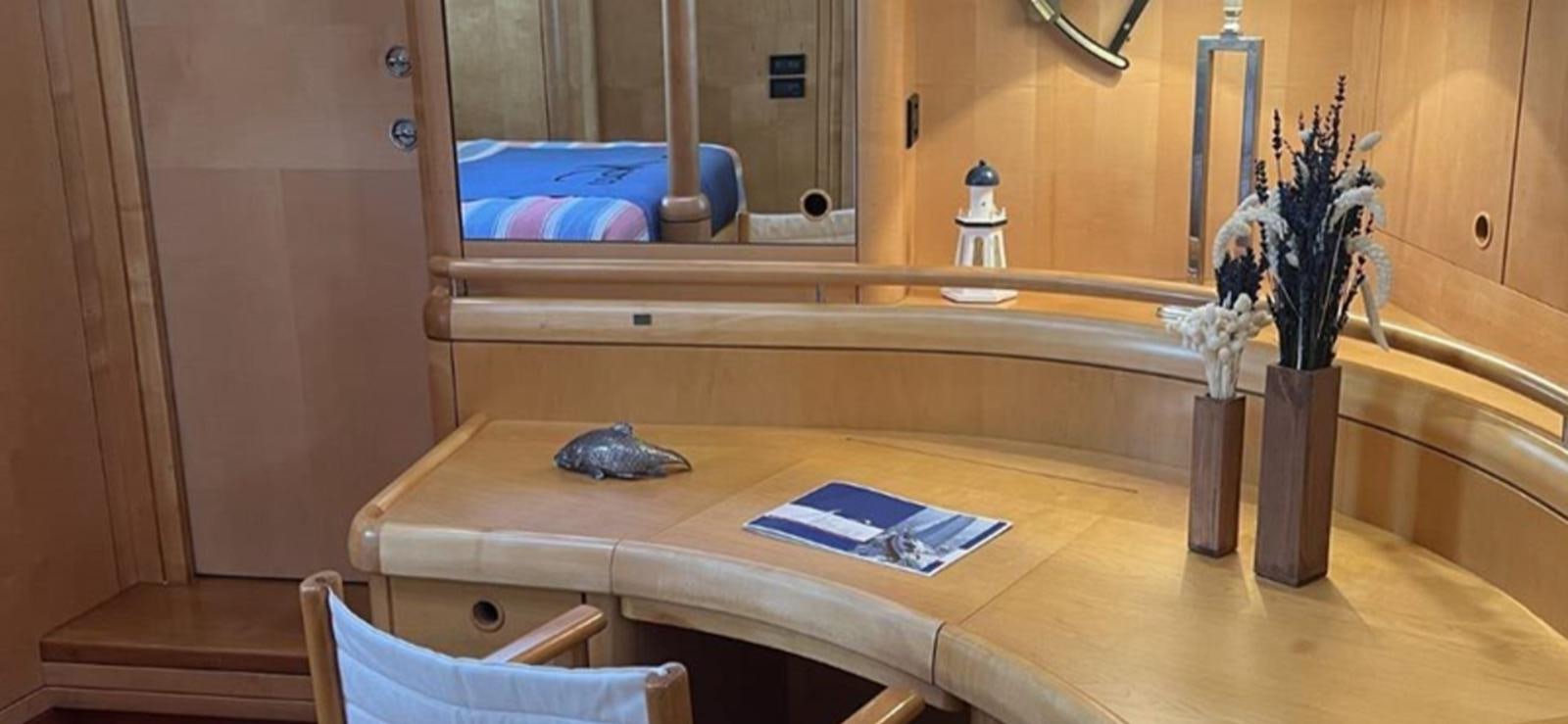 a counter with a mirror and a towel on it aboard NAOS Yacht for Sale