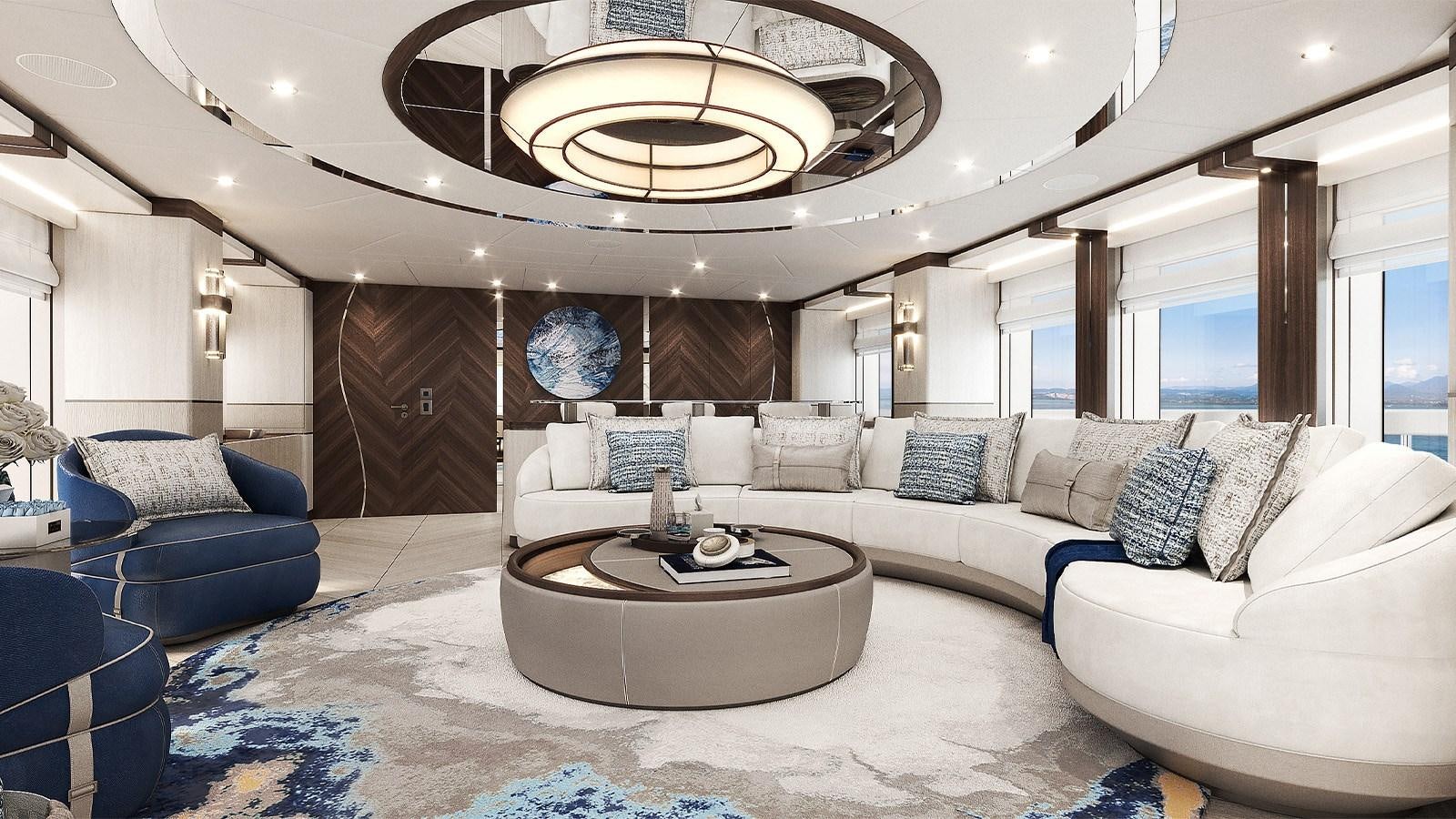 a living room with a large white couch and a round table aboard HEESEN 50M ALUMINIUM YN 21150  SOPHIA Yacht for Sale