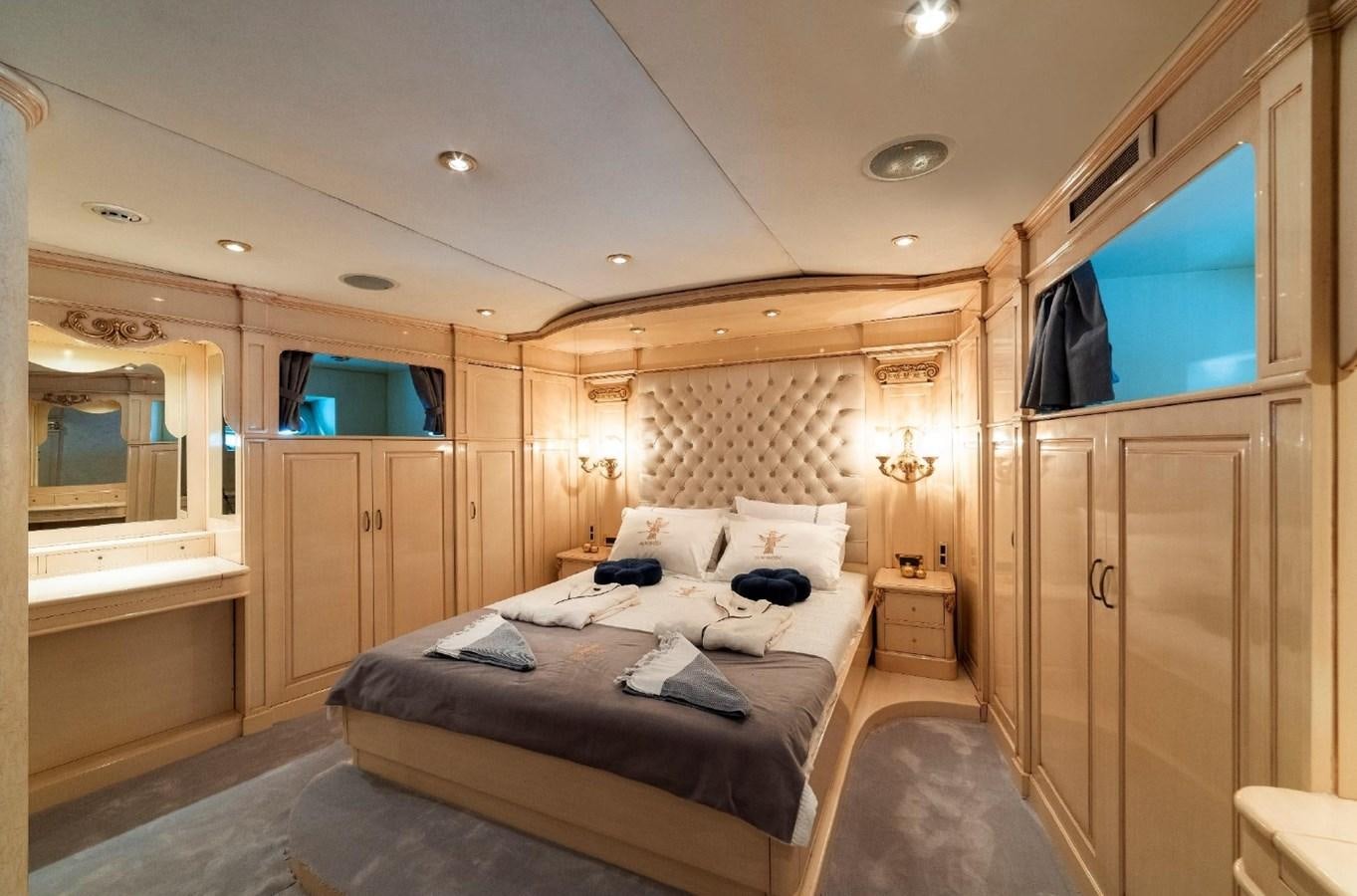 a bedroom with a bed and a television aboard ALKONOST Yacht for Sale