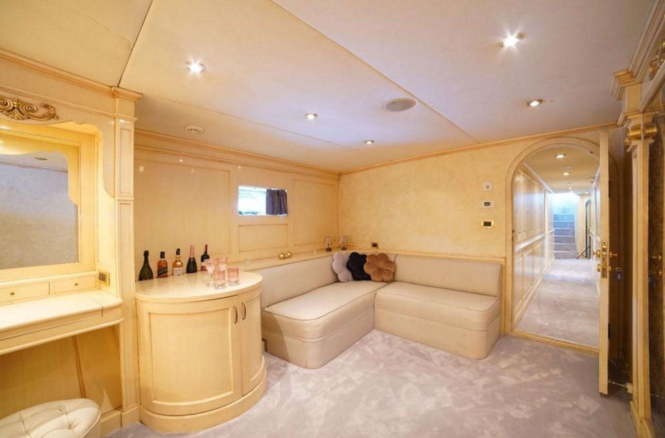 a room with a bed and a mirror aboard ALKONOST Yacht for Sale