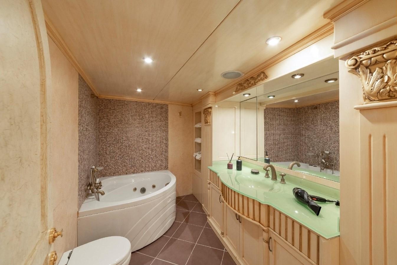 a bathroom with a large mirror aboard ALKONOST Yacht for Sale
