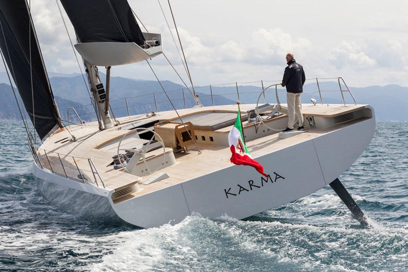 a person standing on a sailboat aboard KARMA Yacht for Sale