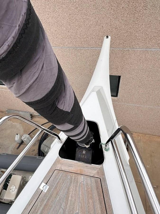 a person's hand holding a white object aboard KARMA Yacht for Sale