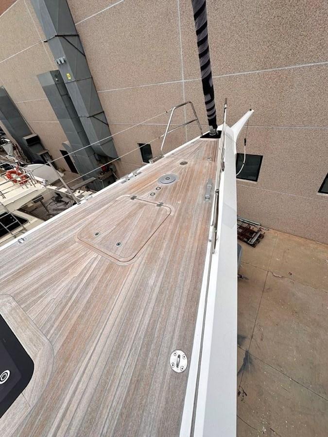 a white surfboard leaning against a wall aboard KARMA Yacht for Sale