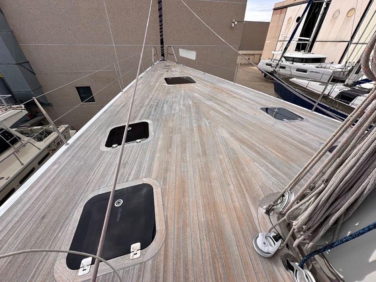 a luggage sits on a deck aboard KARMA Yacht for Sale