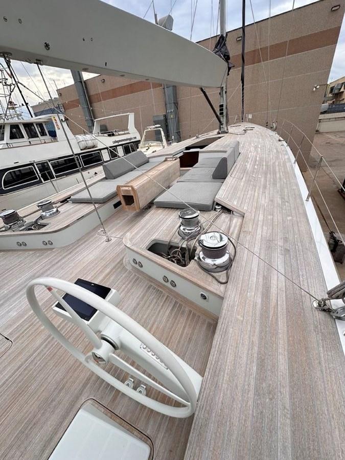 a room with a table and chairs aboard KARMA Yacht for Sale