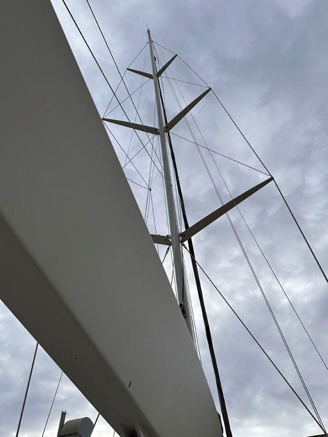 a tall windmill against a cloudy sky aboard KARMA Yacht for Sale
