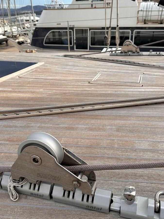 a metal object on a wooden surface aboard KARMA Yacht for Sale