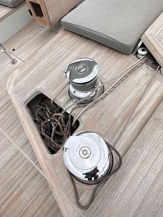 a set of headphones on a wood surface aboard KARMA Yacht for Sale