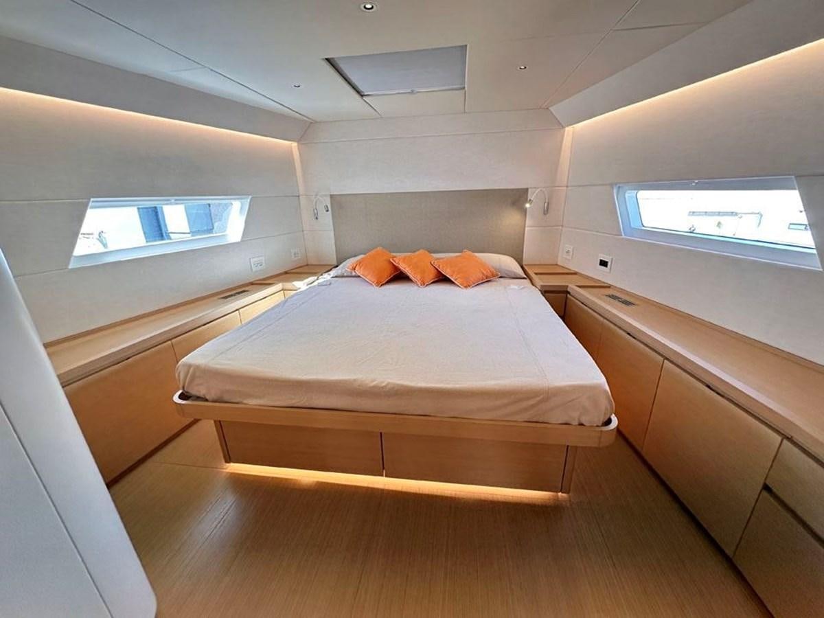 a bed in a room aboard KARMA Yacht for Sale