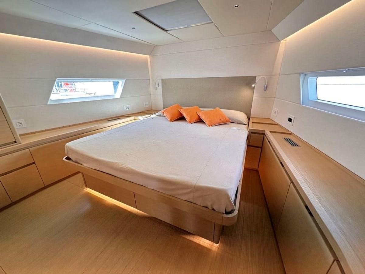 a bed in a room aboard KARMA Yacht for Sale