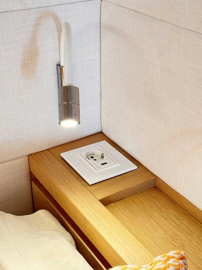 a white rectangular object on a wooden surface aboard KARMA Yacht for Sale