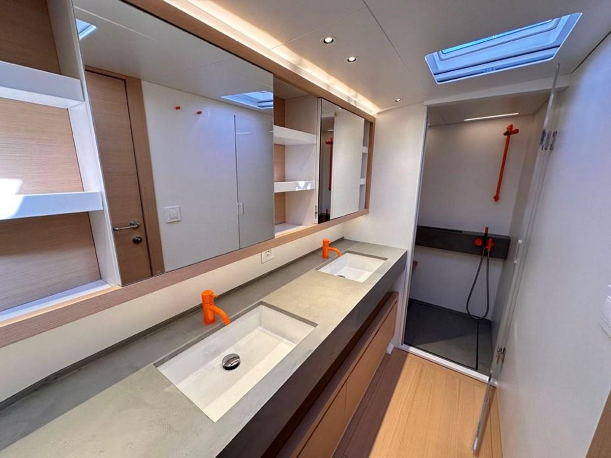 a kitchen with white cabinets aboard KARMA Yacht for Sale