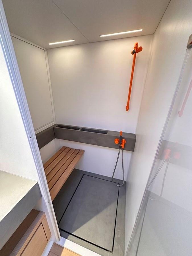 a red object on a black shelf aboard KARMA Yacht for Sale