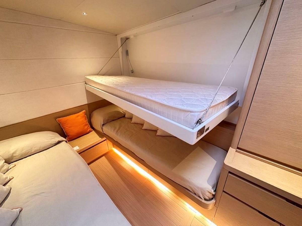 a room with two beds aboard KARMA Yacht for Sale