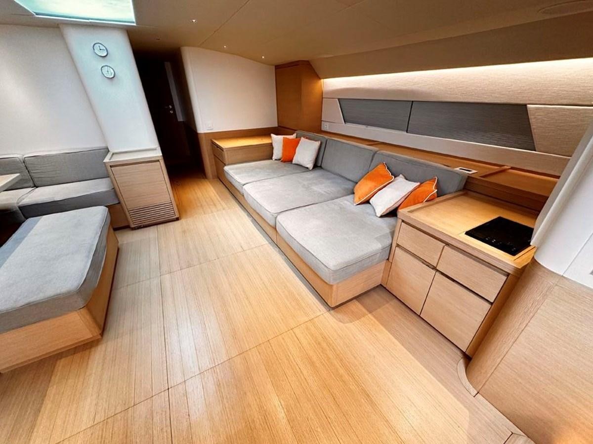 a room with a bed and a couch aboard KARMA Yacht for Sale