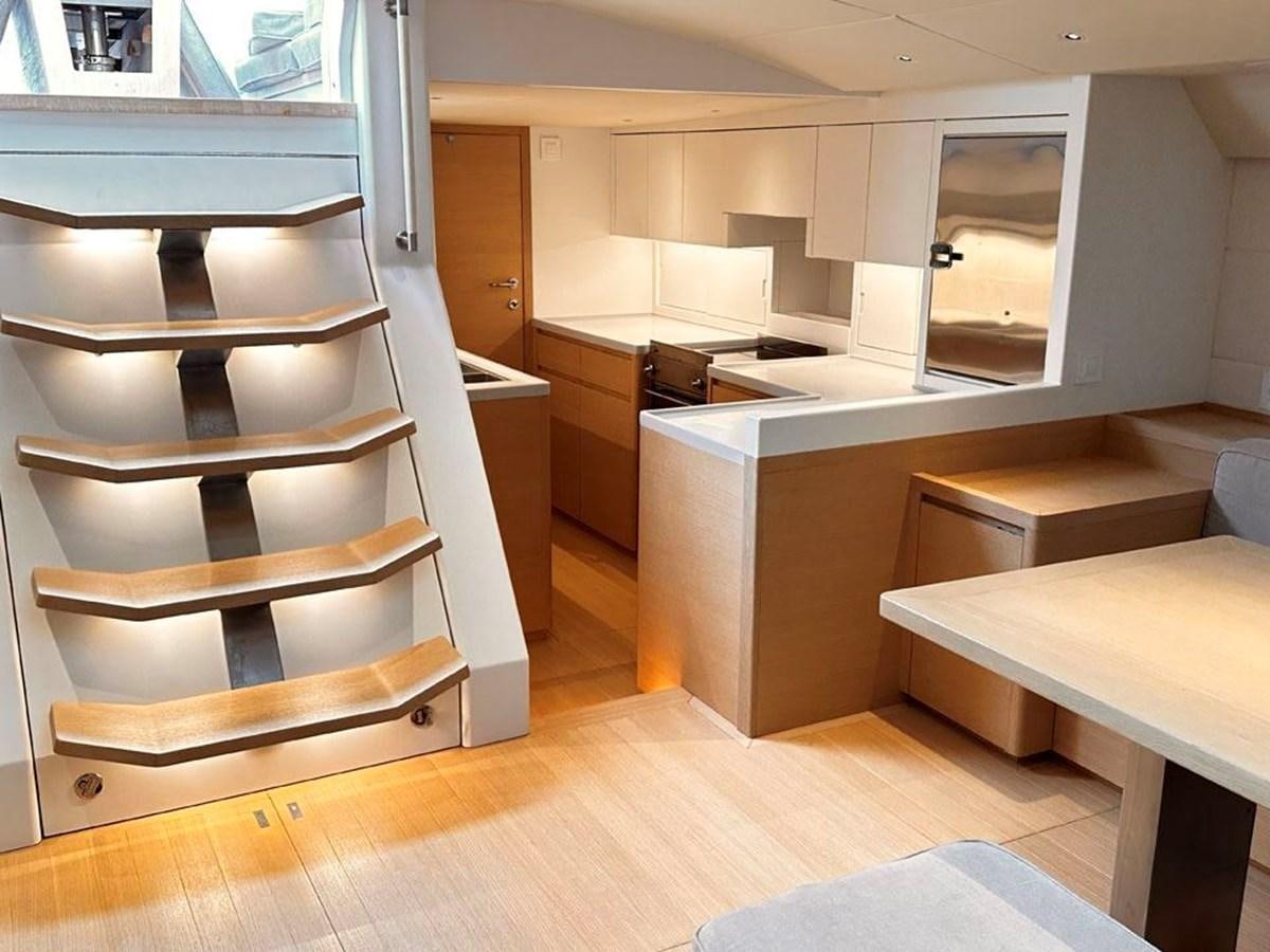 a room with a desk and a shelf aboard KARMA Yacht for Sale