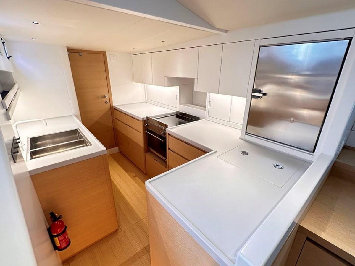 a kitchen with a large island aboard KARMA Yacht for Sale