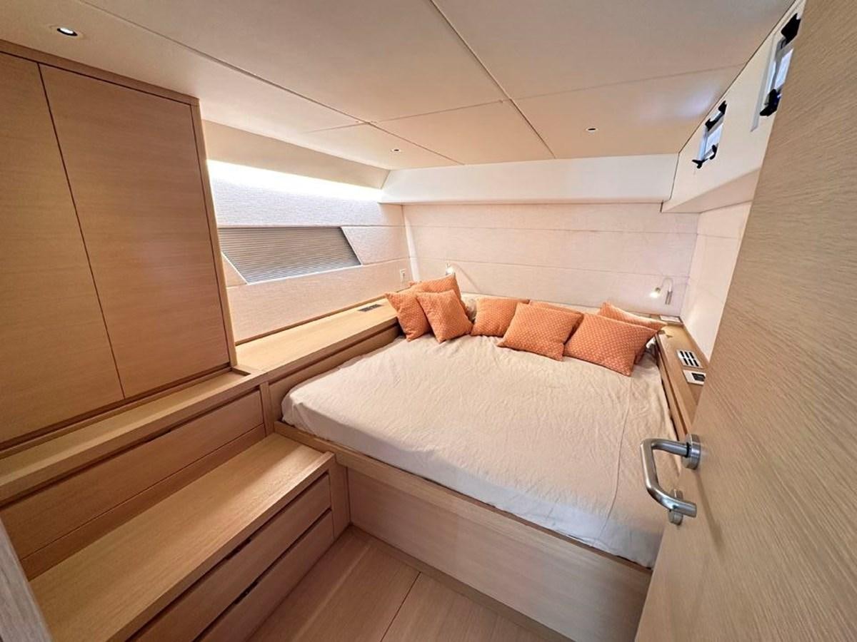 a bed in a room aboard KARMA Yacht for Sale