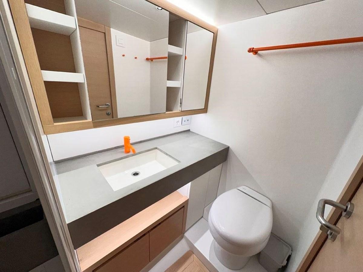 a bathroom with a sink and a toilet aboard KARMA Yacht for Sale