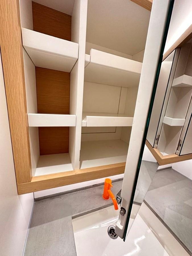 a white ladder in a room aboard KARMA Yacht for Sale