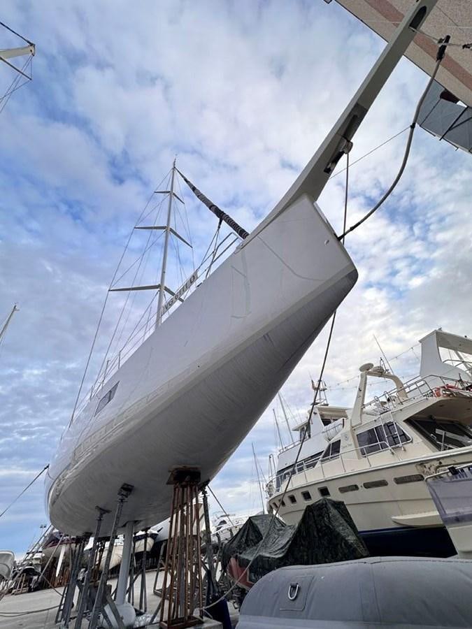 a large white boat docked aboard KARMA Yacht for Sale