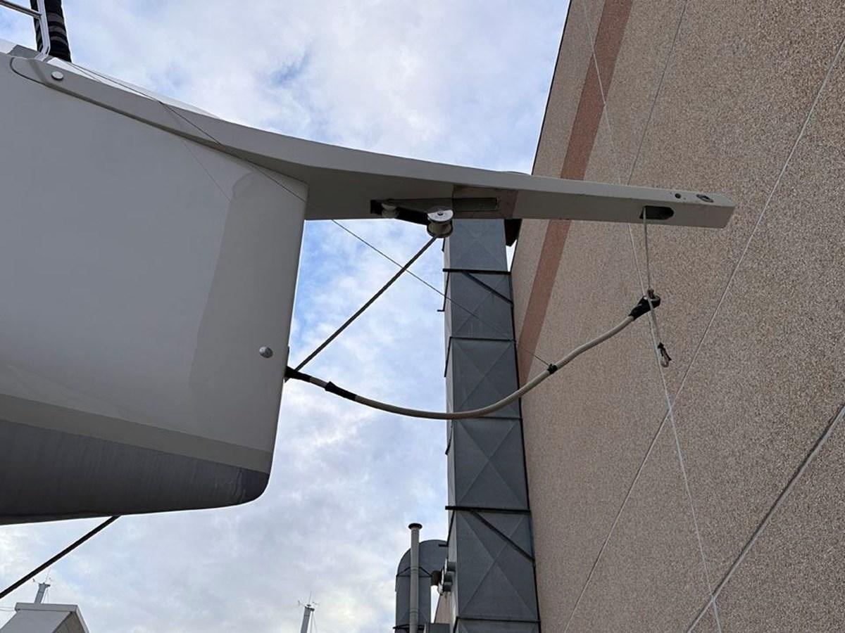 a large white building with a large antenna aboard KARMA Yacht for Sale