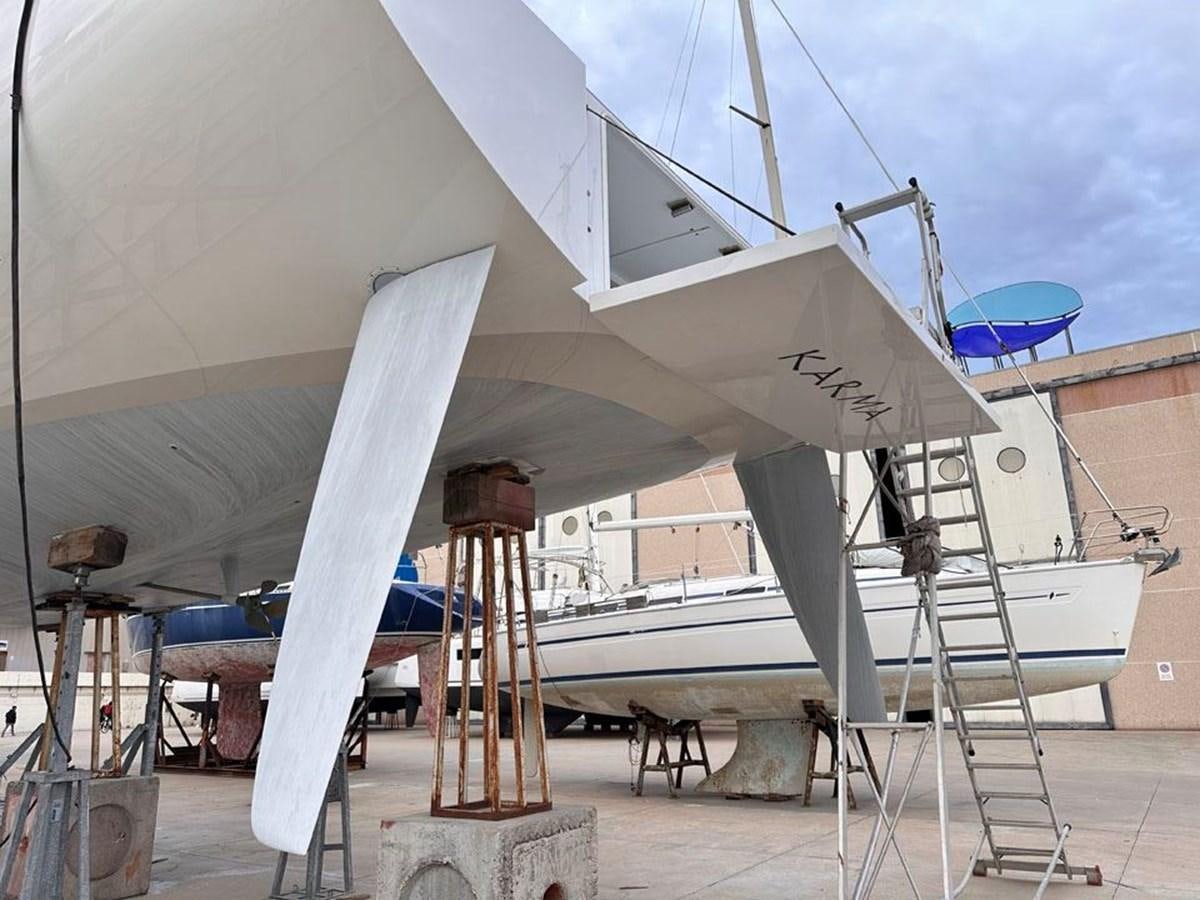 a large white building with a ladder aboard KARMA Yacht for Sale