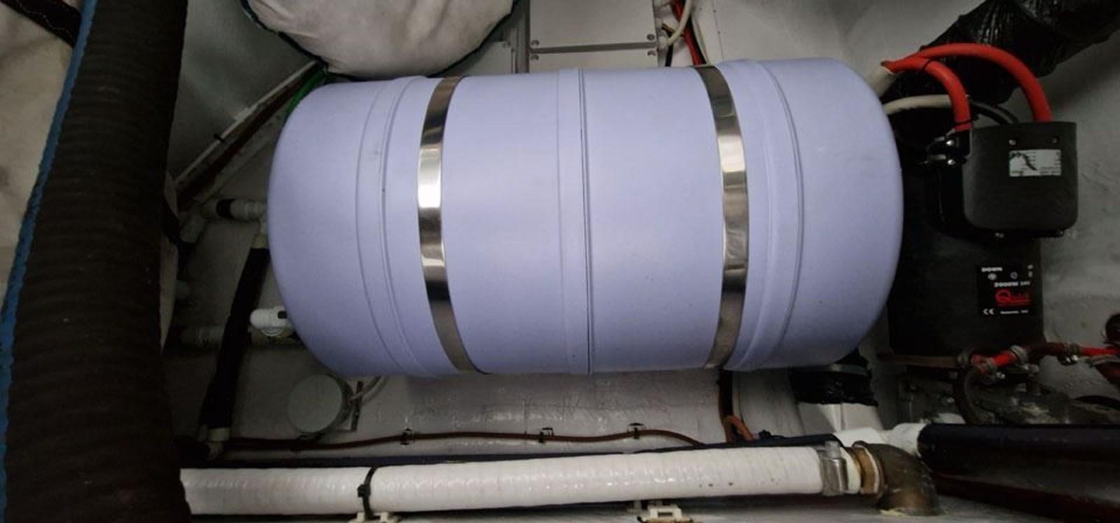 a person wearing a white and grey shoe aboard KARMA Yacht for Sale